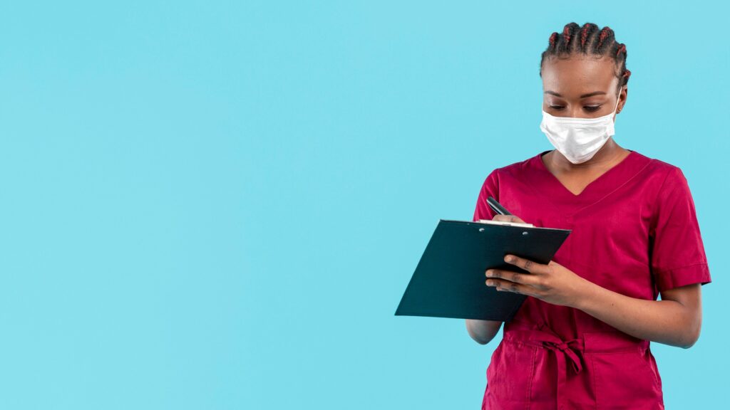 female-doctor-wearing-mask-writes-clipboard